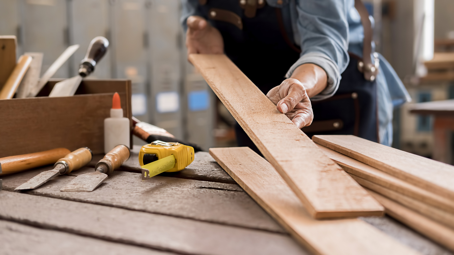 Carpenter Working with Lumber
